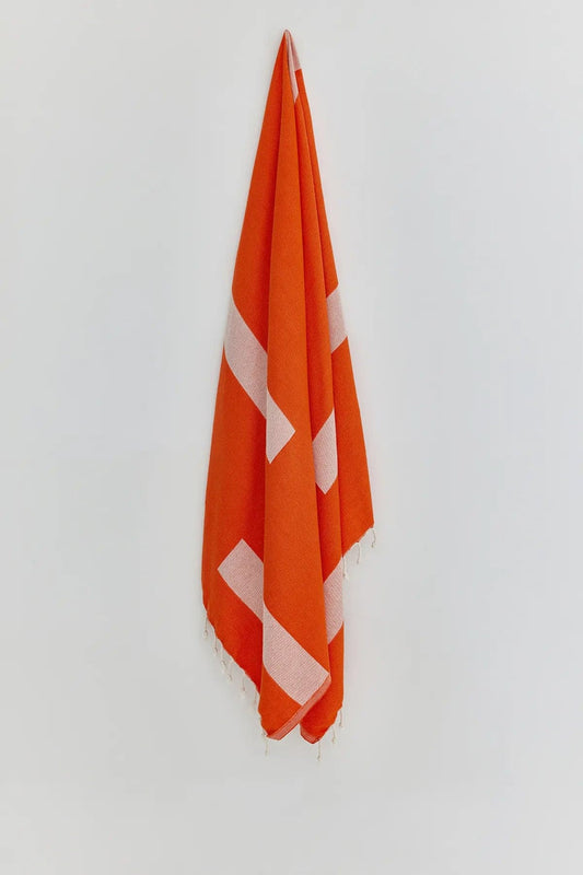 Comb Sicilian Orange Double-Faced Turkish Towel by Cove & Fold - hanging view