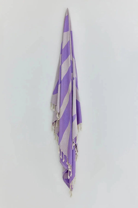 Fiori Lilac Turkish Beach Towel by Cove & Fold - hanging view