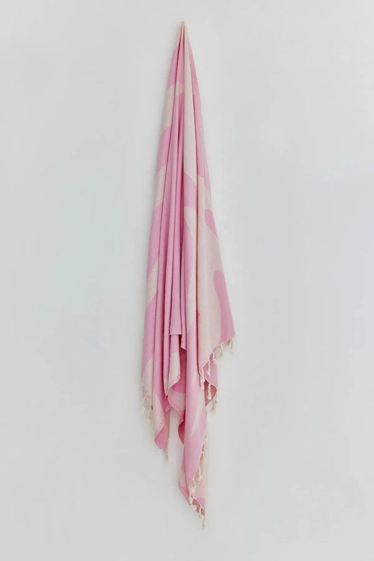 Fiori Pink Blush Turkish Beach Towel by Cove & Fold - hanging view