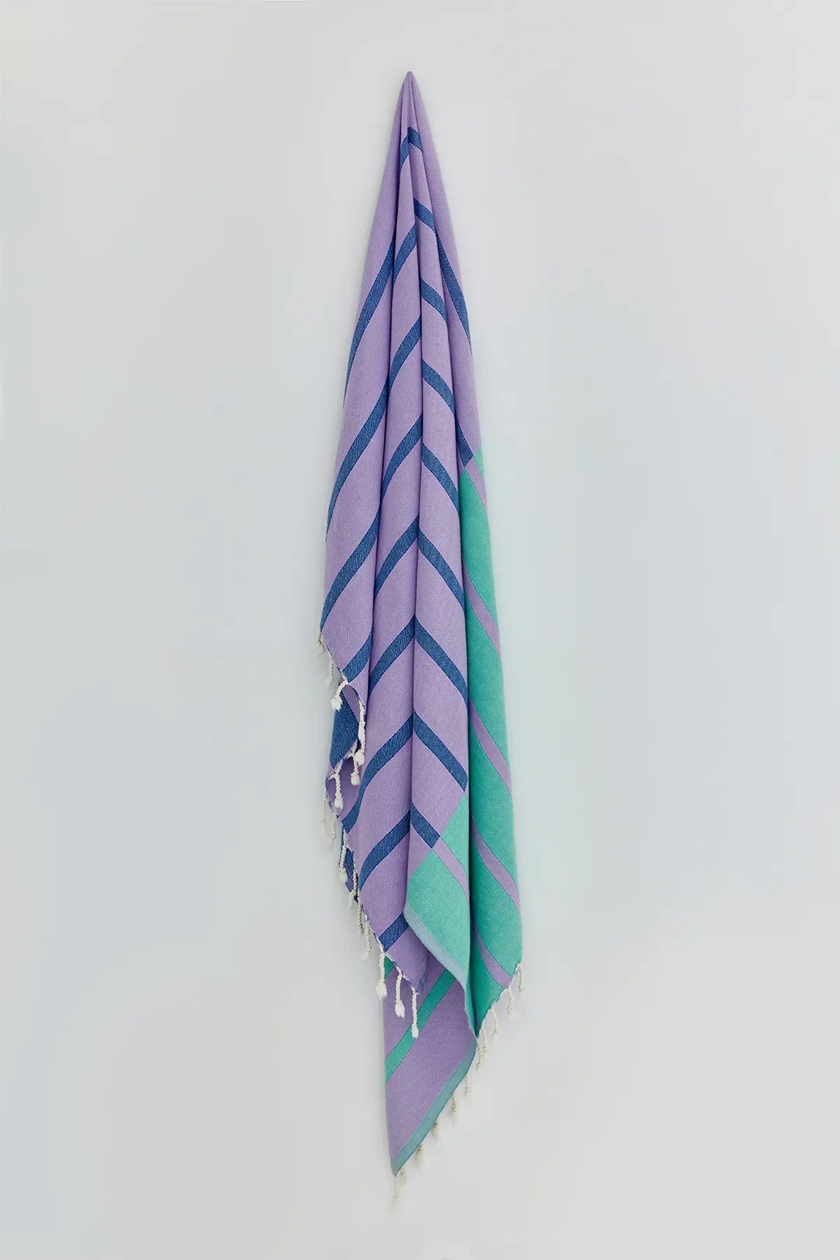 Lane Lilac Green Double-Faced Turkish Towel by Cove & Fold - hanging view