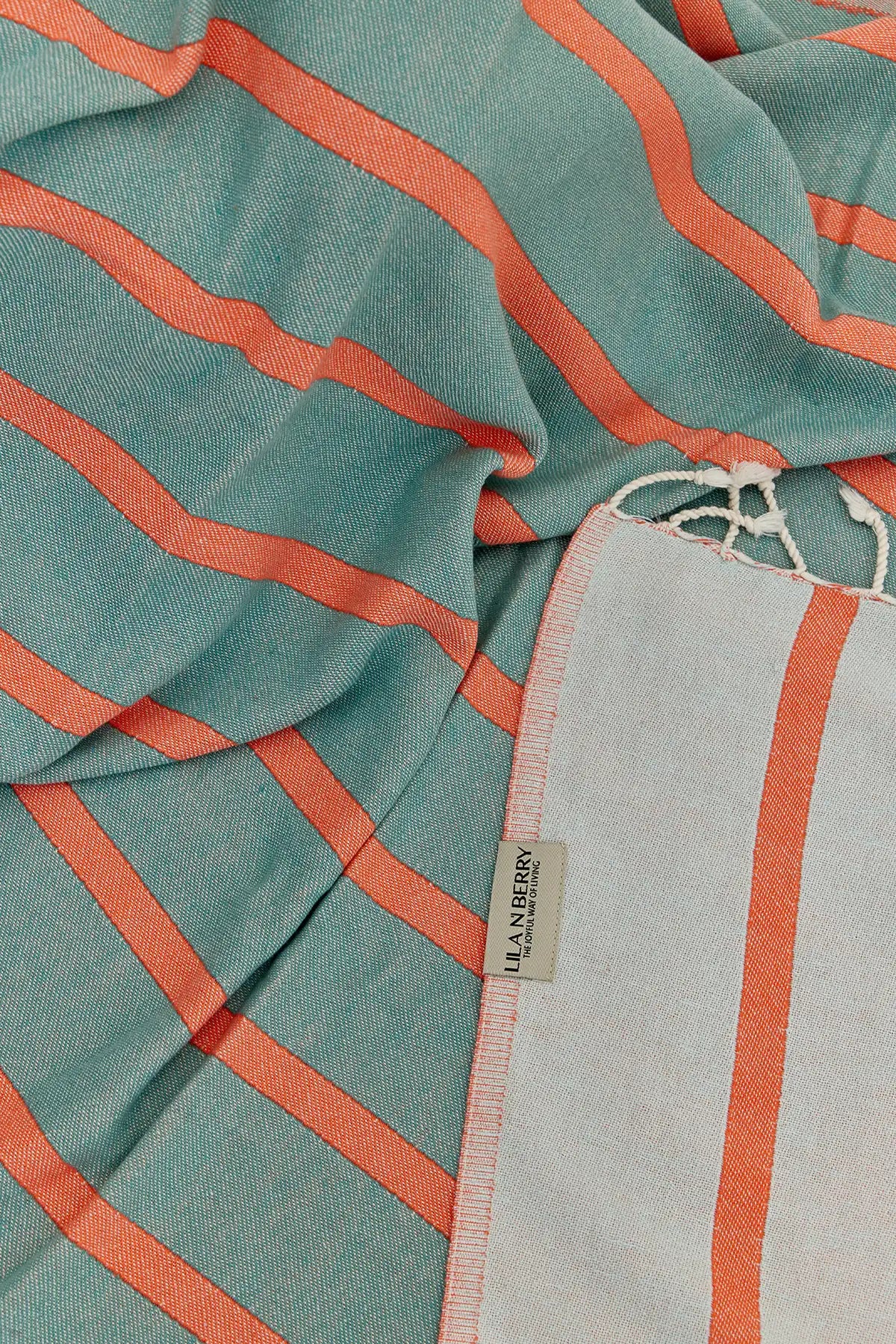 Lane Peach Cream Double-Faced Turkish Towel by Cove & Fold - draped detail