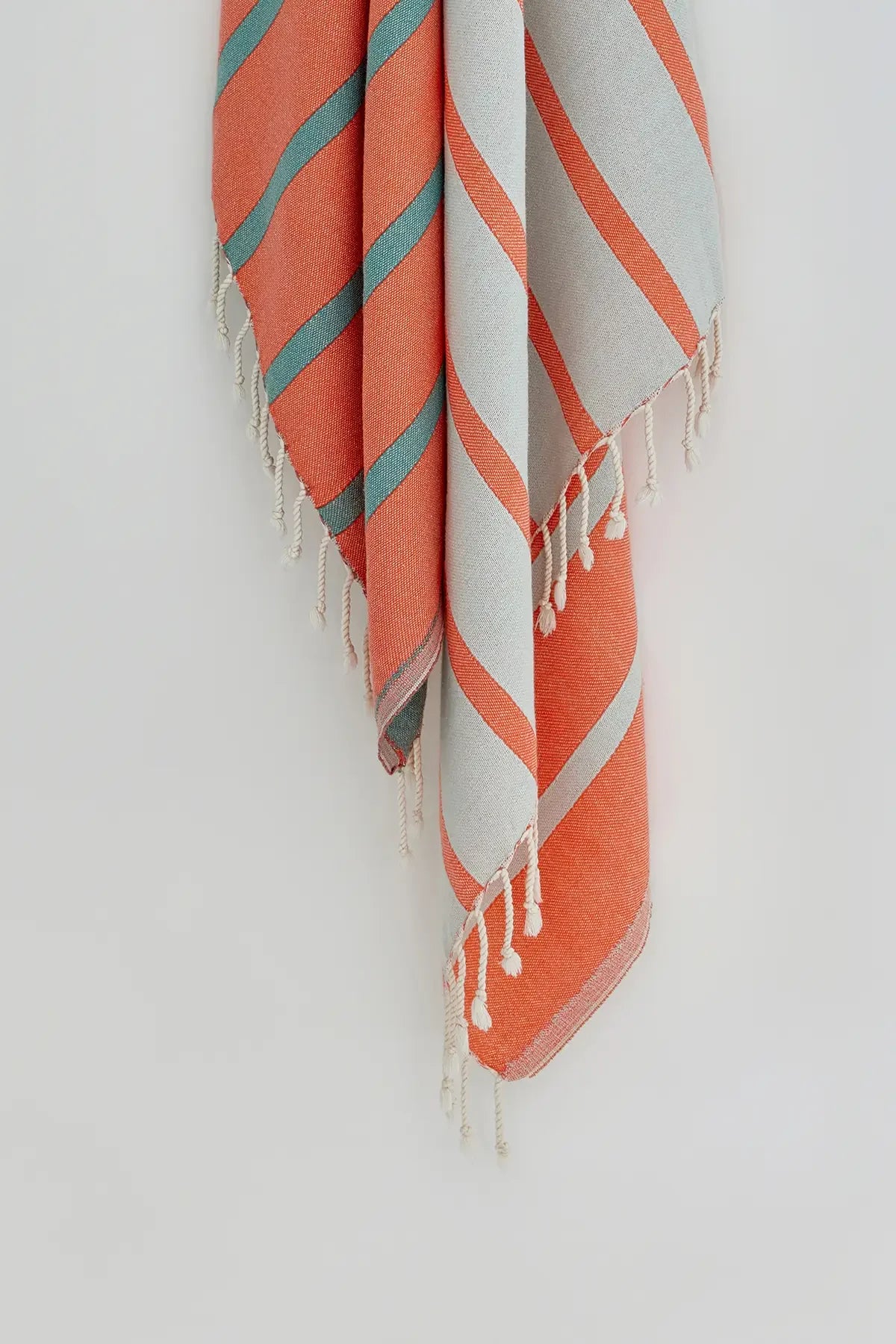 Lane Peach Cream Double-Faced Turkish Towel by Cove & Fold - hanging detail