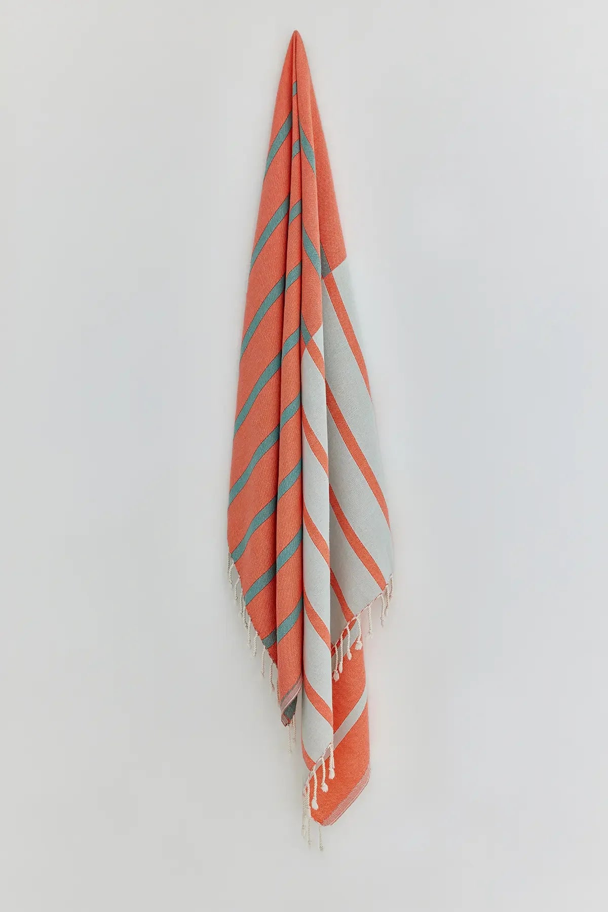 Lane Peach Cream Double-Faced Turkish Towel by Cove & Fold - hanging view