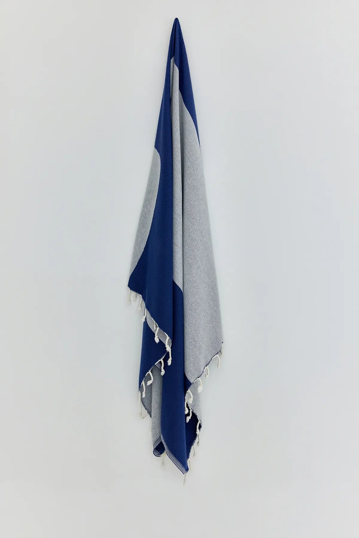 La Luna Indigo Turkish Beach Towel by Cove & Fold - hanging view