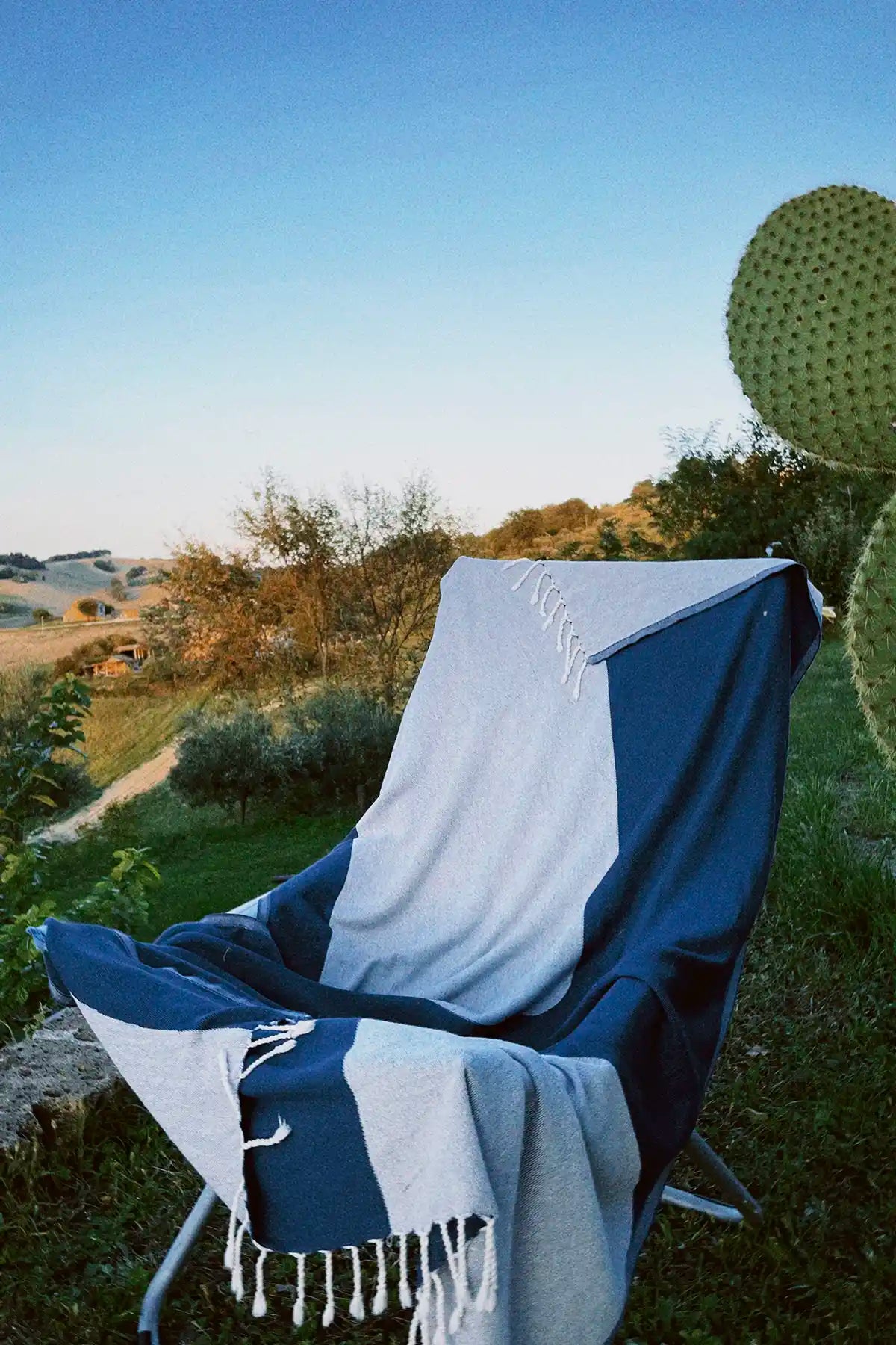 La Luna Indigo Turkish Beach Towel by Cove & Fold - lifestyle view