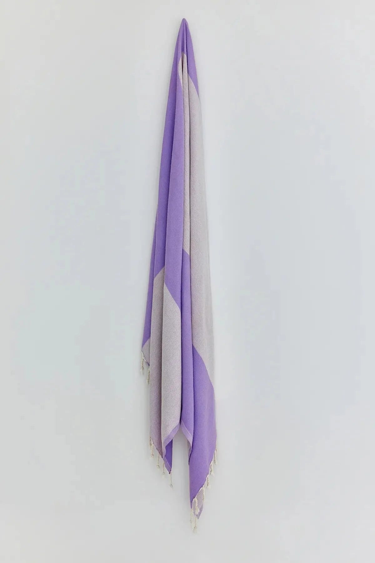 La Luna Lilac Turkish Beach Towel by Cove & Fold - hanging view