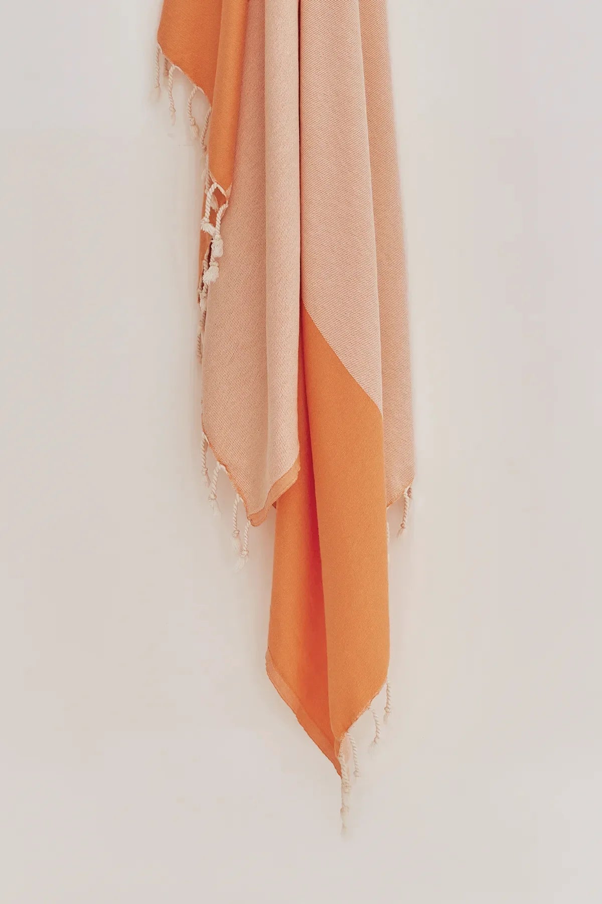 La Luna Peach Turkish Beach Towel by Cove & Fold - hanging detail