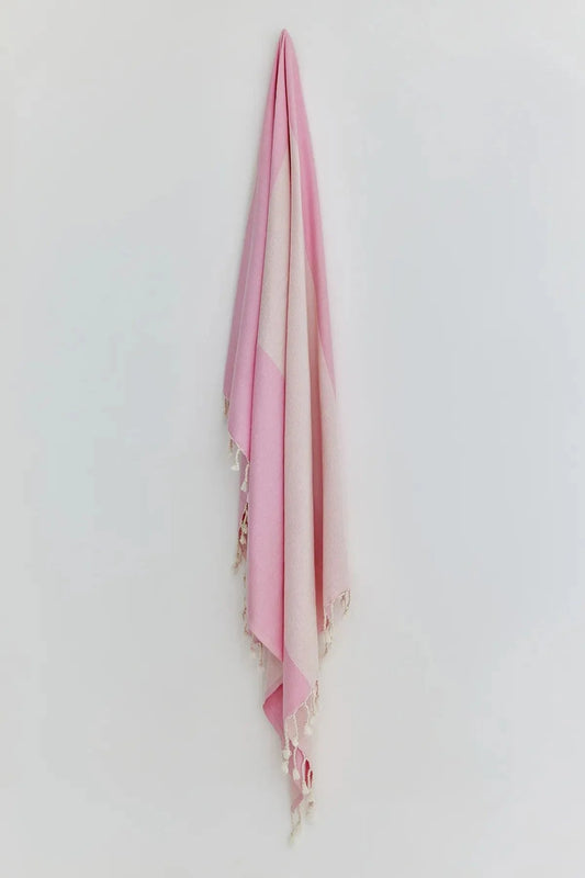 La Luna Pink Blush Turkish Beach Towel by Cove & Fold - hanging view