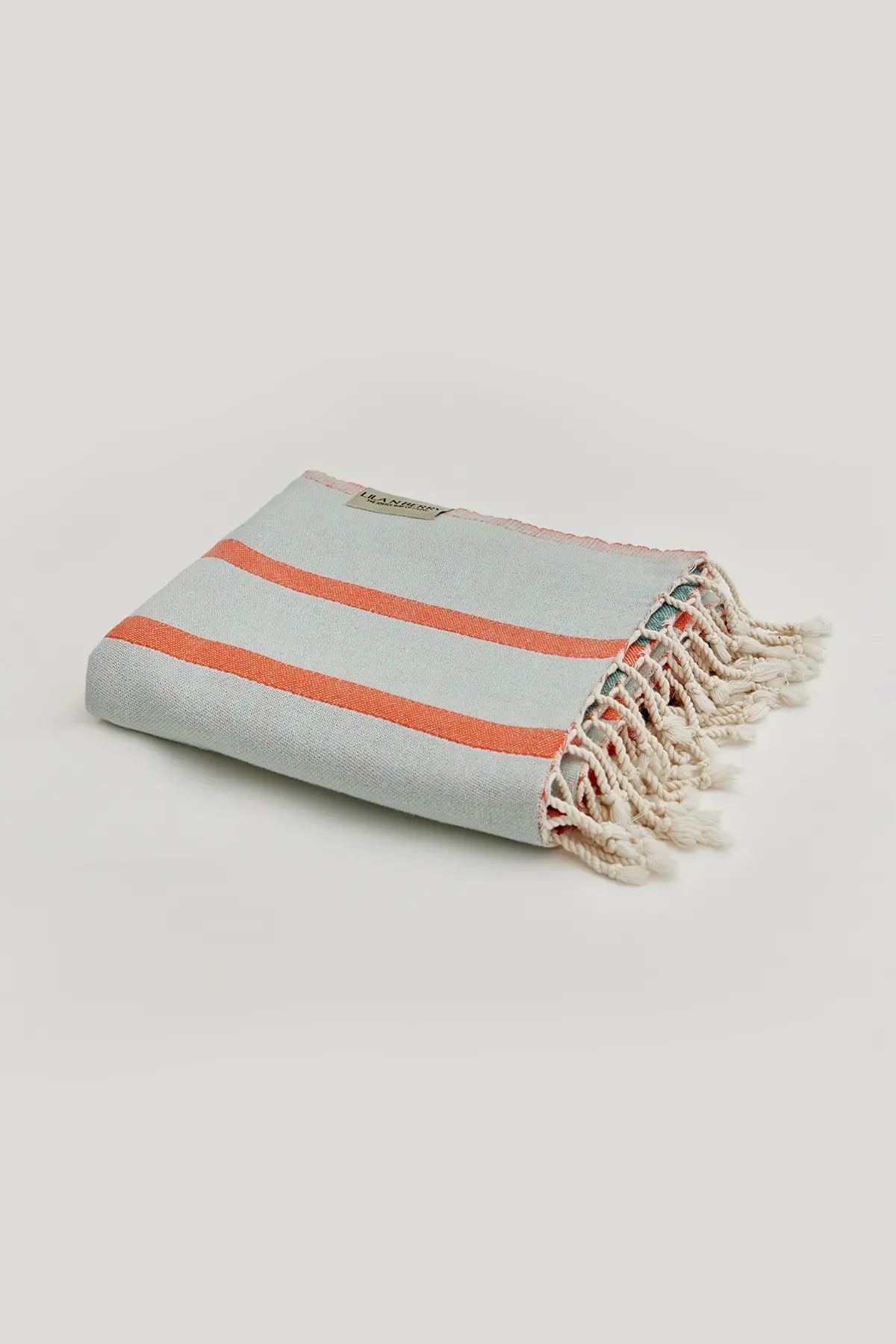 Lane Peach Cream Double-Faced Turkish Towel by Cove & Fold - folded view