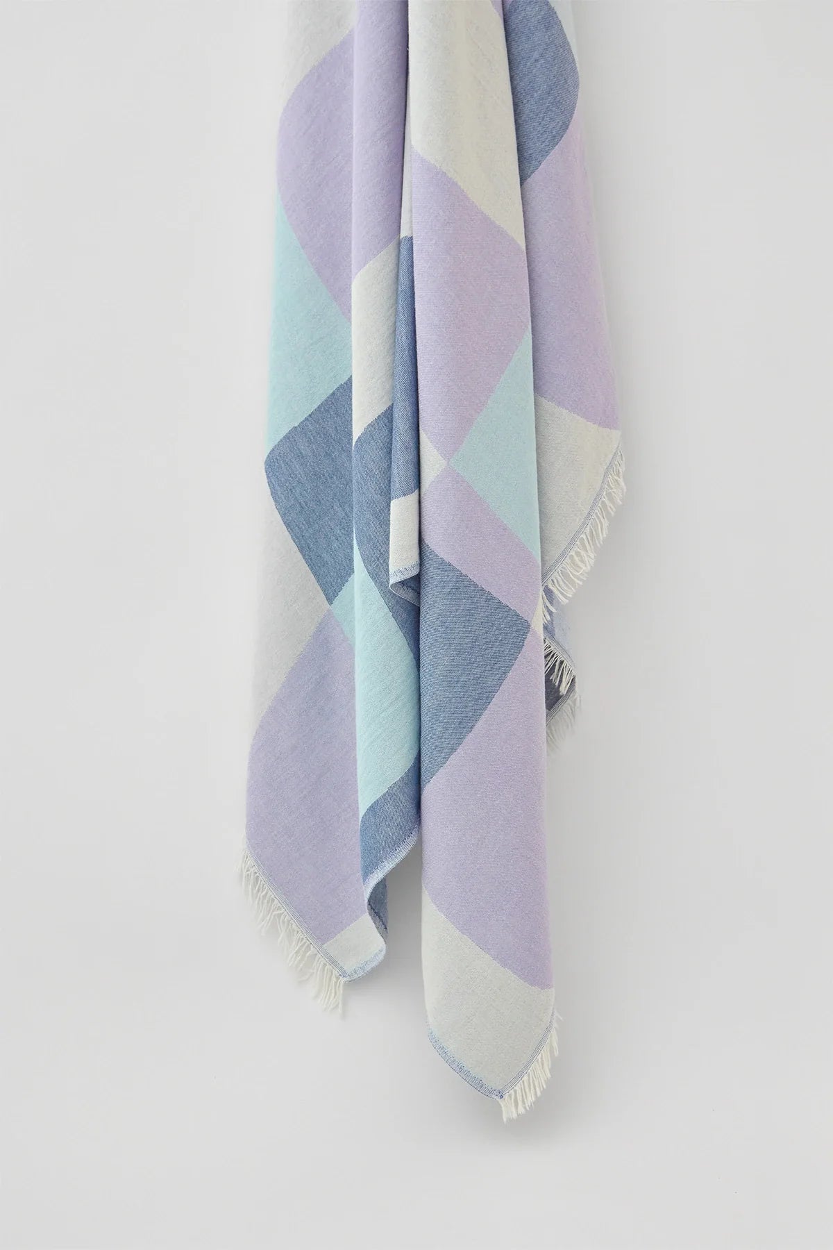 Pale Pluie Mellow Indigo XL Turkish Towel by Cove & Fold - hanging detail