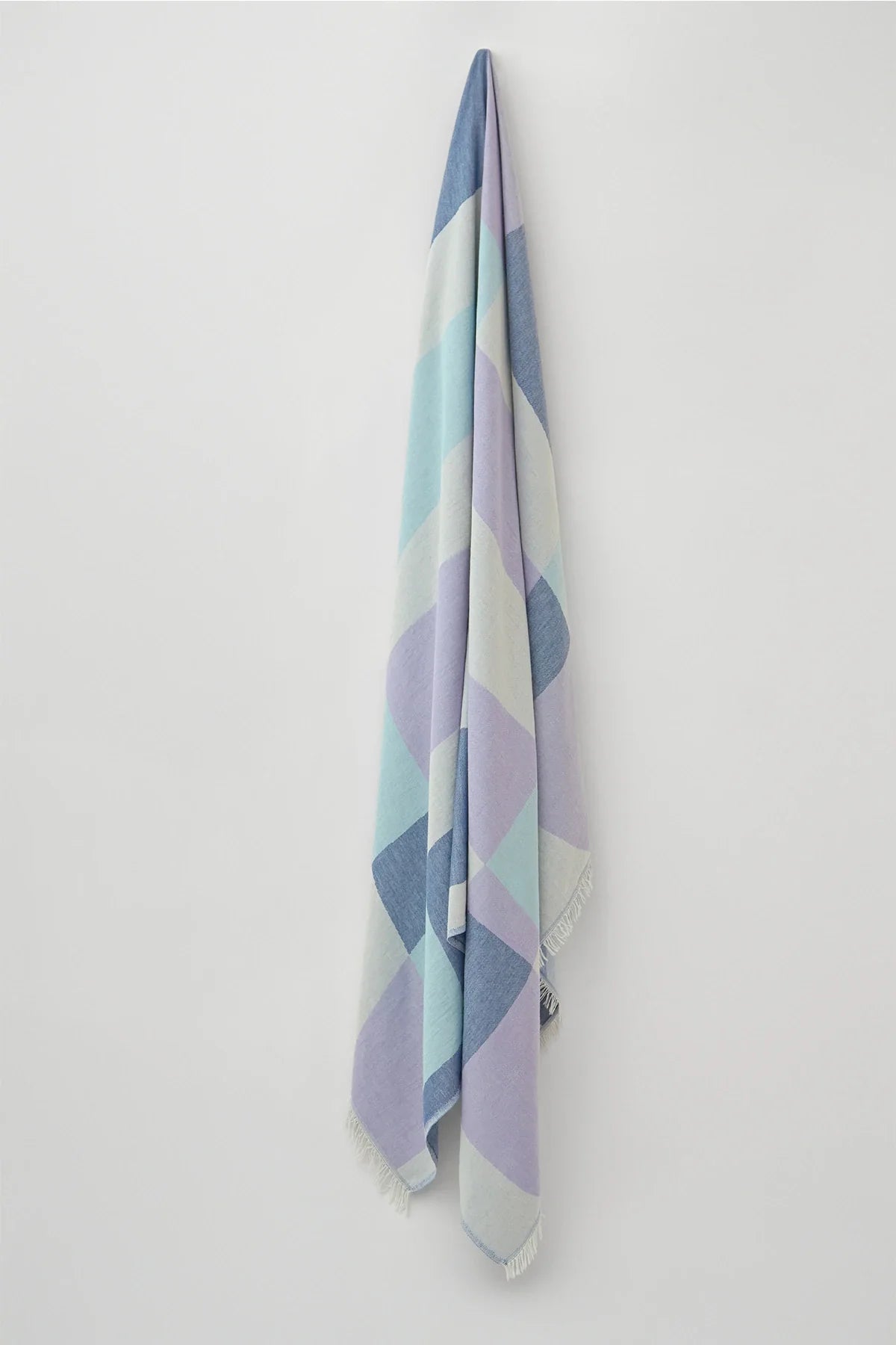 Pale Pluie Mellow Indigo XL Turkish Towel by Cove & Fold - hanging view