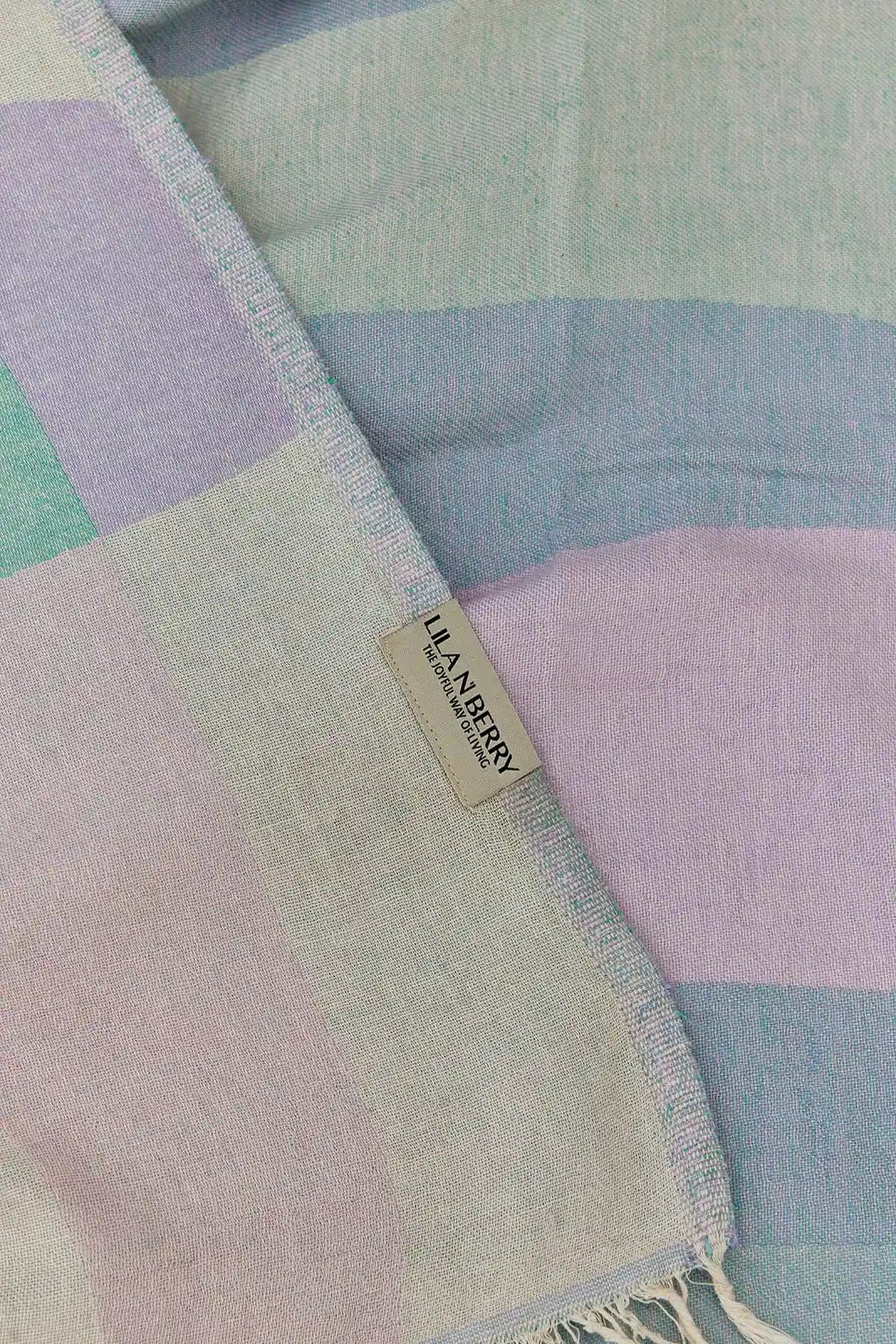 Pale Pluie Mellow Green Dobby Turkish Towel by Cove & Fold - draped detail
