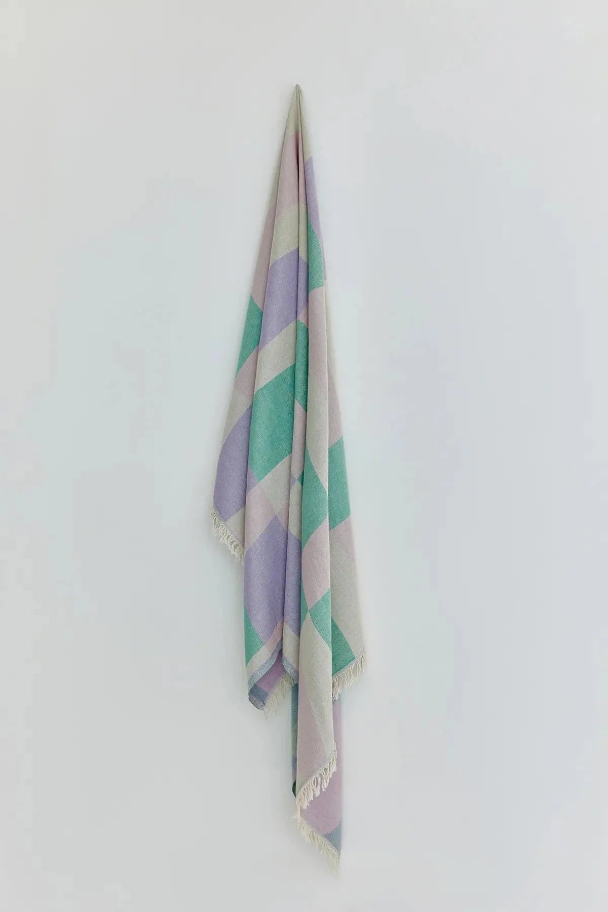 Pale Pluie Mellow Green Dobby Turkish Towel by Cove & Fold - hanging view