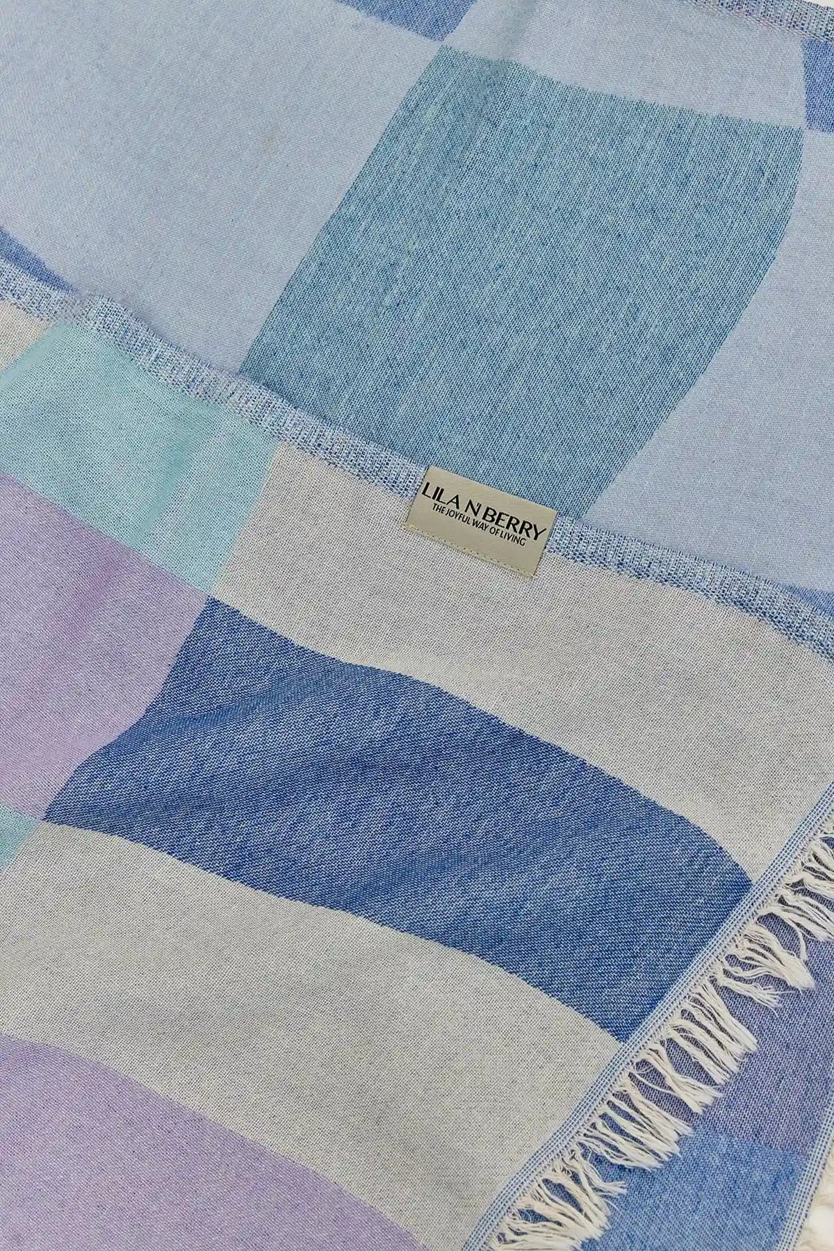 Pale Pluie Mellow Indigo Dobby Turkish Towel by Cove & Fold - draped detail