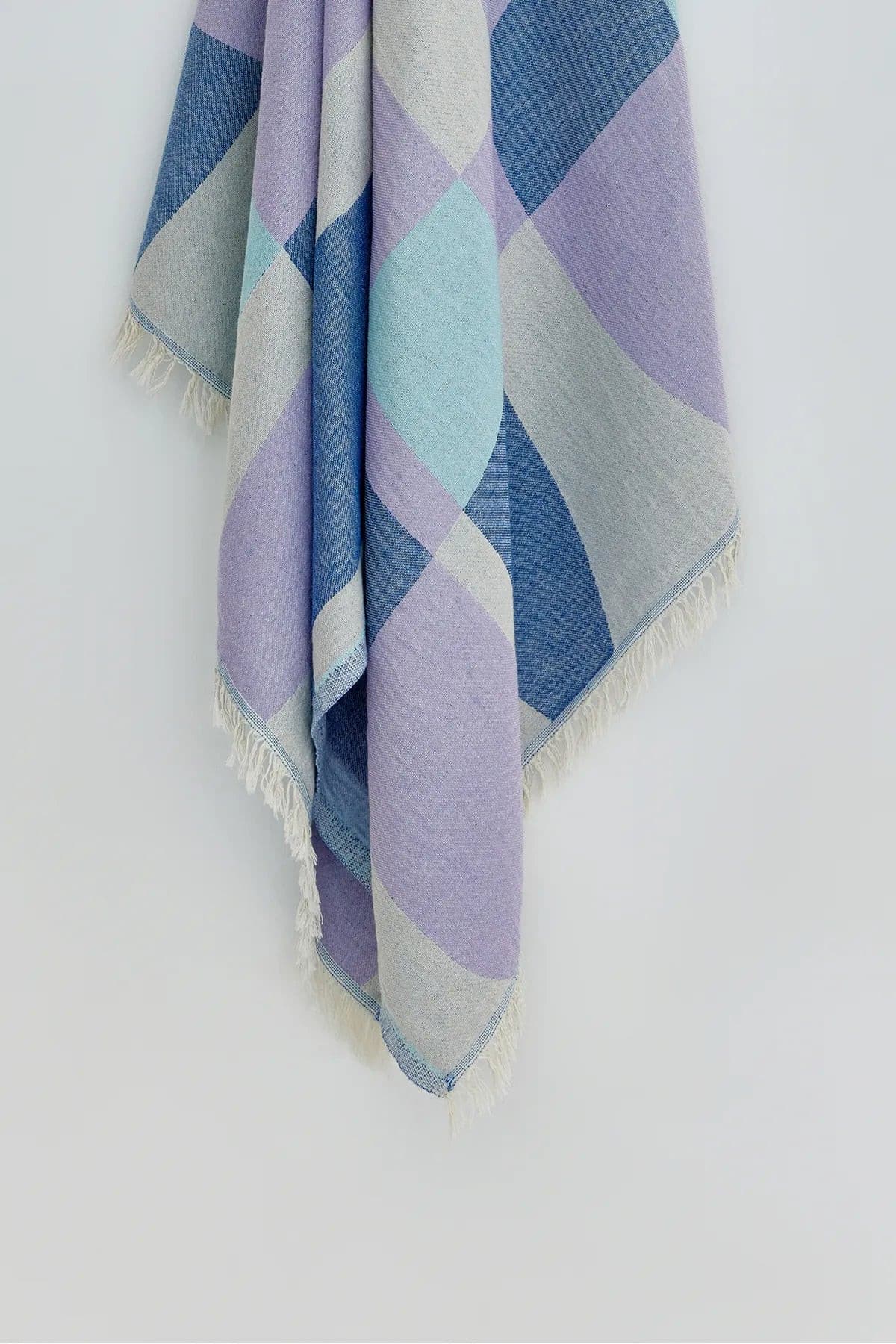 Pale Pluie Mellow Indigo Dobby Turkish Towel by Cove & Fold - hanging detail