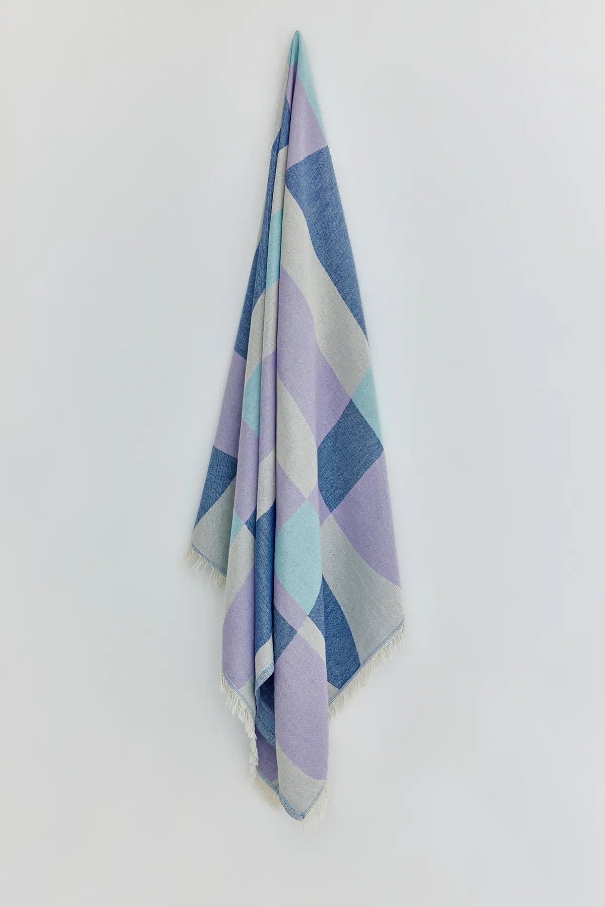 Pale Pluie Mellow Indigo Dobby Turkish Towel by Cove & Fold - hanging view