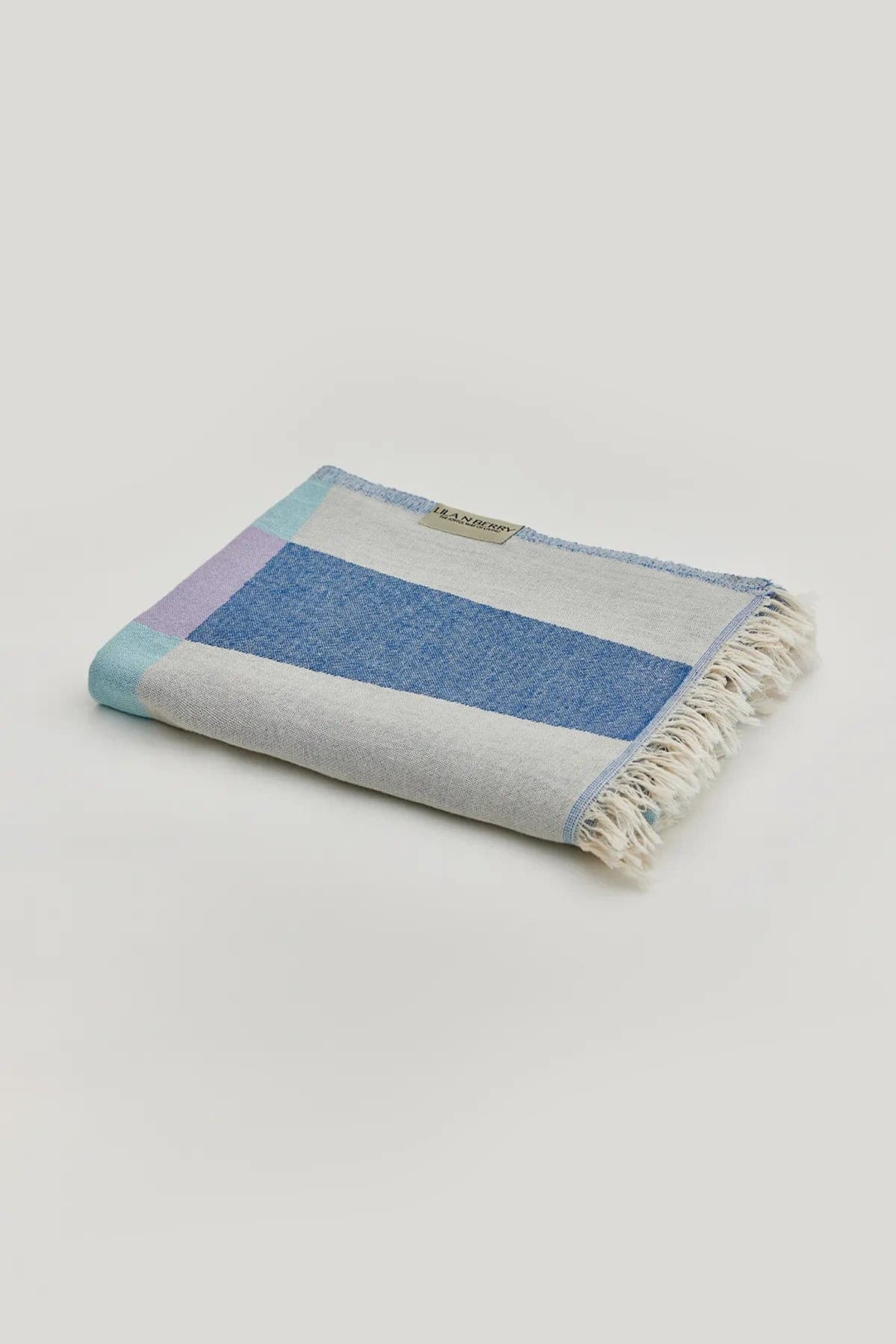 Pale Pluie Mellow Indigo Dobby Turkish Towel by Cove & Fold - folded view